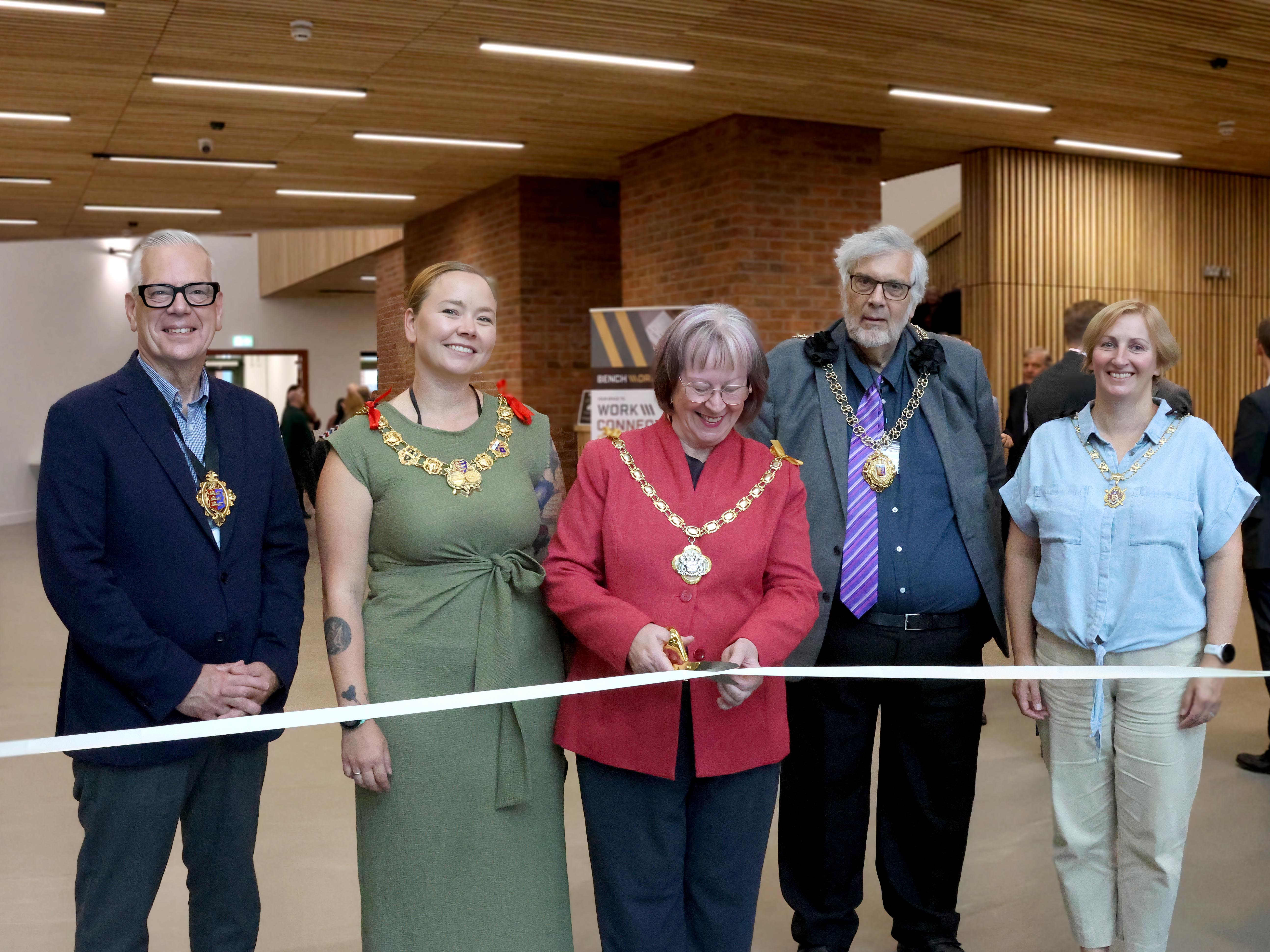 Image of Chairman of the District, with Dover, Deal and Sandwich cutting the ribbon at the opening event